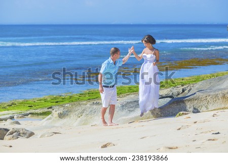 Loving Wedding Couple on Ocean Coastline.Bali.Indonesia.