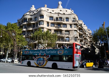 BARCELONA, SPAIN - SEPTEMBER 29: Tourist bus in Barcelona, Spain on September 29, 2013. Barcelona Bus Turistic is an official touristic bus service that shows the city with an audio guide.