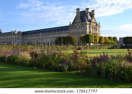PARIS, FRANCE - OCTOBER 18: View of Louvre Museum from the Tuileries Garden in Paris, France on October 18, 2013. The Louvre is the biggest Museum in Paris and one of the major tourist attractions.