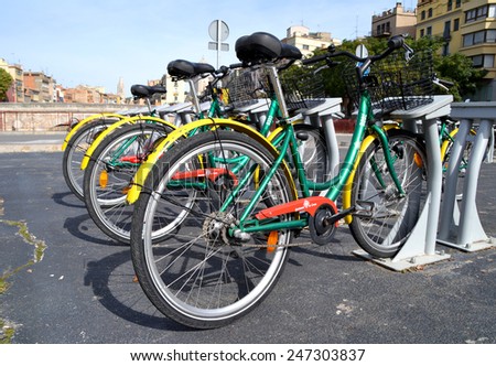 GIRONA, SPAIN - OCTOBER 15: Some bicycles of the Girocleta service in Girona, Spain on October 15, 2014. With the bicycle sharing service people can rent bicycles for short trips.