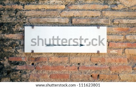 Empty white stone sign on old wall