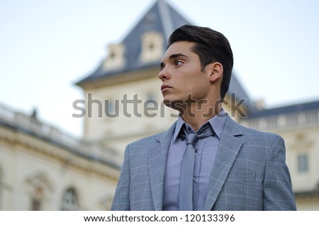 Portrait of handsome young male model  by classic palace