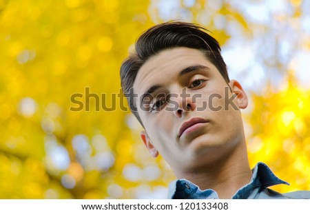 Portrait of handsome young male model from below