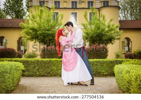 Romantic Fairy Tale Couple Dancing in Beautiful Palace Garden in Peaceful Idyllic Setting, Prince and Princess Gazing at Each Other