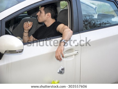 Detail of Man Wearing Wrist Watch Tossing Crumpled Ball of Refuse Out of Car Window onto Ground, Close Up of Irresponsible Man Littering Garbage from Car