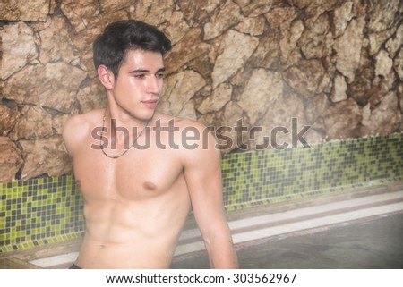 Young Shirtless Man Gazing Seductively at Camera and Relaxing in Steam Sauna - Turkish Bath - Sweating