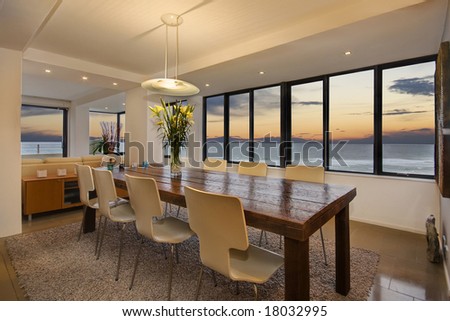 A dining room in a luxury apartment with ocean views