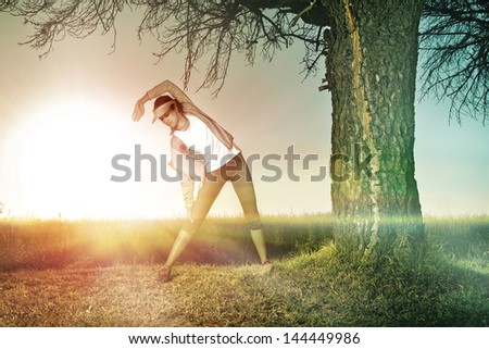 woman under trees stretching or running under trees at sunrise