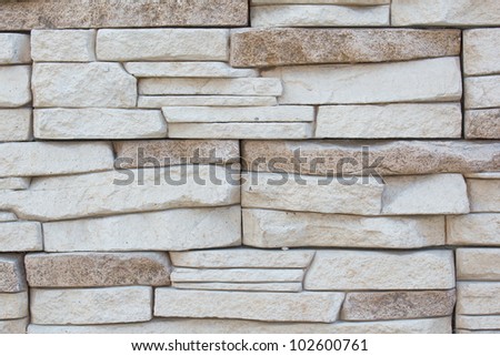 The wall, lined with narrow bricks. Close-up