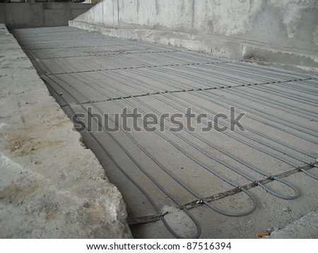 Underfloor central heating and cooling construction phases
