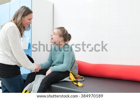 Disability a disabled child together with a special needs carer / Disability a disabled child being cared for