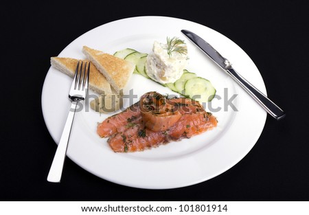 Smoked salmon gravadlax with herbs potato salad cucumber and toast inc clipping path