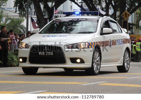 PAHANG, MALAYSIA - AUG 31 :  The Royal Malaysian Police Mitsubishi Lancer cars participate National Day, celebrated the 55th anniversary Independence on August 31,2012 in Kuantan, Pahang, Malaysia