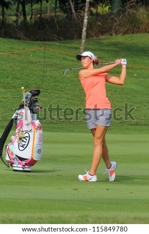 KUALA LUMPUR, MALAYSIA - OCTOBER 10: Michelle Wie of the USA drives the ball on the fairway of hole #6 during the Sime Darby LPGA 2012 golf tournament on Oct 10, 2012 in Kuala Lumpur, Malaysia.