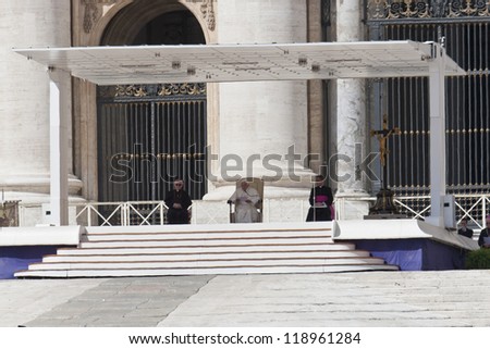 VATICAN CITY, ITALY - APRIL 25: Pope Benedict XVI blesses people at Saint Peter\'s square during the Audience on April 25, 2012. Papal Audience are held on Wednesdays if the Pope is in Rome.