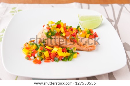 Salmon fillet with mango salsa, healthy eating. selective focus