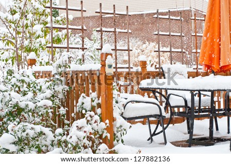 Snow on garden patio, winter scenery