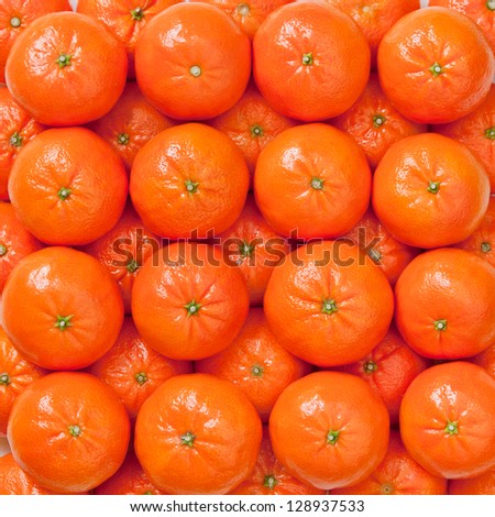 Pile of Fresh mandarins, oranges background