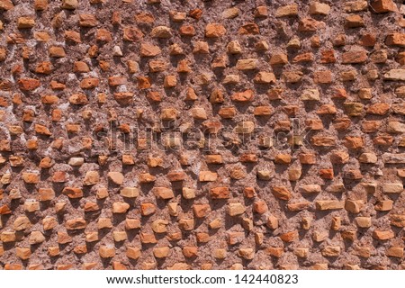 Close up of old ancient brick wall at Roman Forum   composed of thin clay bricks placed at an angle. Rome, Italy