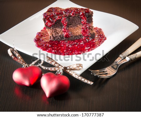 Chocolate ganache mousse cake with raspberry sauce for two on Valentines day.