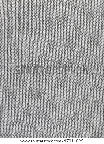Close-up of seamless gray knitted fabric texture.