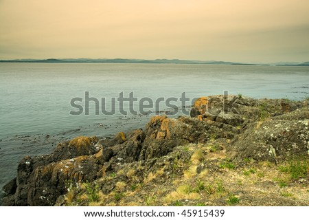 The rocks of San Juan Island with the view of Vancouver island