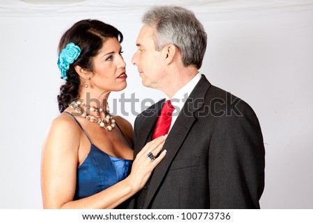 Cute mature couple, man and woman, in formal dress and a very romantic mood