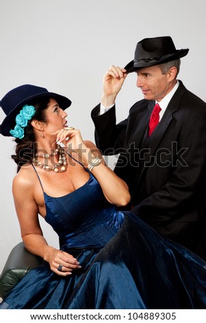 Couple together in semi formal dress, and a romantic mood