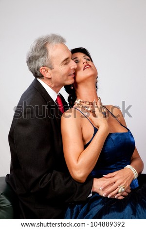 Couple together in semi formal dress, and a romantic mood