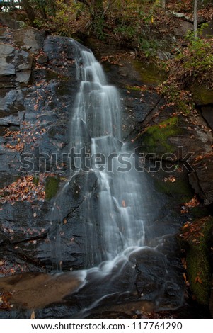 Tom Branch Falls, in the Great Smoky Mountains National Park, near Bryson City, North Carolina, in the fall of the year with the leaves turning different colors