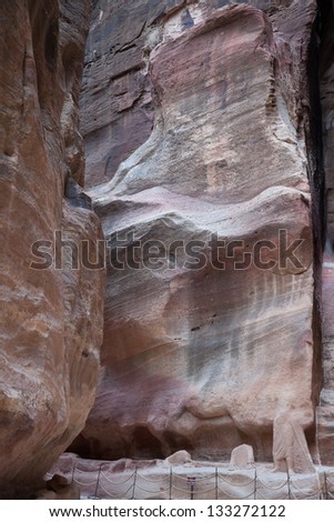From the Lost City of Petra in Jordan, passageway of As-Siq, with high stone walls