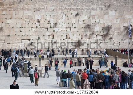 JERUSALEM - FEBRUARY 17: Jews gather to pray at the Wailing Wall, the last remaining wall of Herod\'s Temple and a sacred site for Jews and Christians on February 17, 2013 in Jerusalem, Israel.