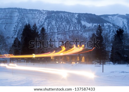 Dawn in Yellowstone National Park, in the depth of winter with the snow plow going off to clear the road of snow
