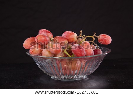 Crystal bowl of purple grapes