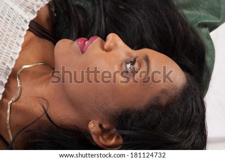 Pretty black woman, her face surrounded by her lovely black hair