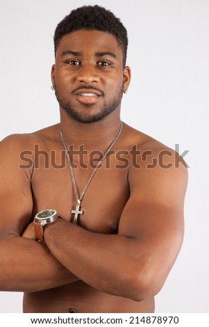 stock-photo-handsome-black-man-topless-looking-thoughtfully-at-the-camera-with-his-arms-folded-214878970.jpg