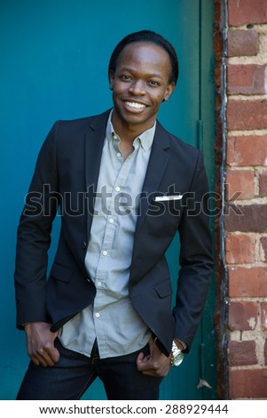 Handsome black man in suit coat, smiling