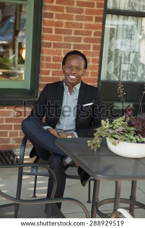 Handsome black man in suit coat, smiling