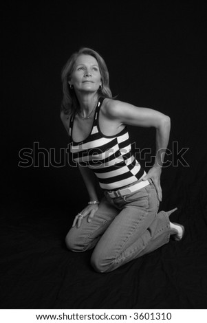 Pretty mature woman kneeling