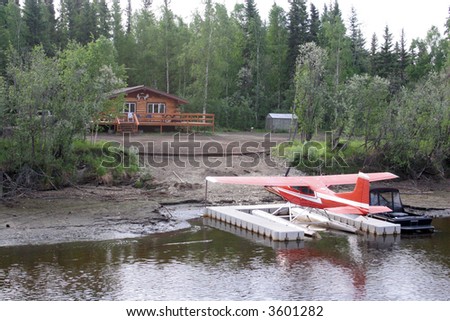 Alaska home on the River with float plane