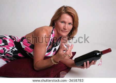pretty mature woman with wine and glasses