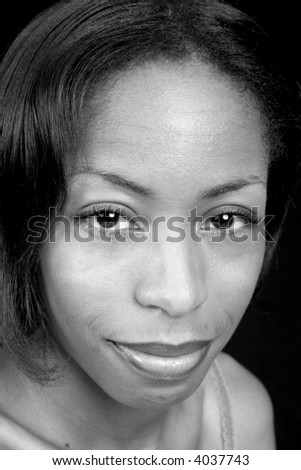 Pretty black woman looking at camera in black and white