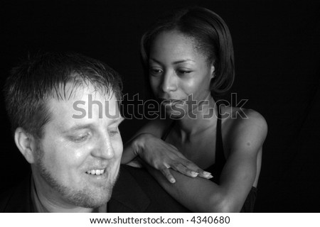Mixed racial couple together and romantic in black and white