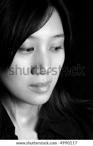 Pretty chinese woman thinking in black and white