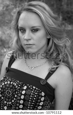 Black and white of pretty woman outside