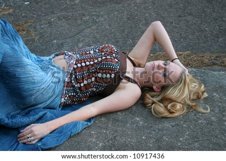 Pretty blond outside laying down