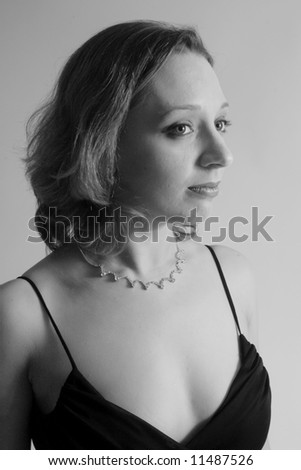 Lovely woman looking to the right with serious expression, in blue tent