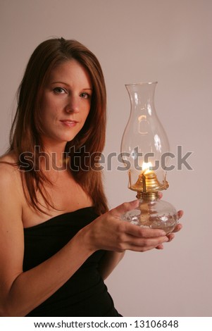 Cute lady holding a lighted lantern
