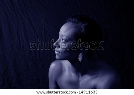 African american woman looking left in a blue tone