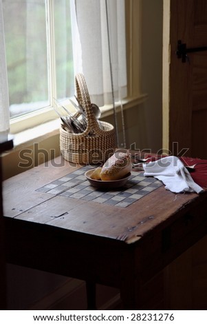 Side table with bread and utensils